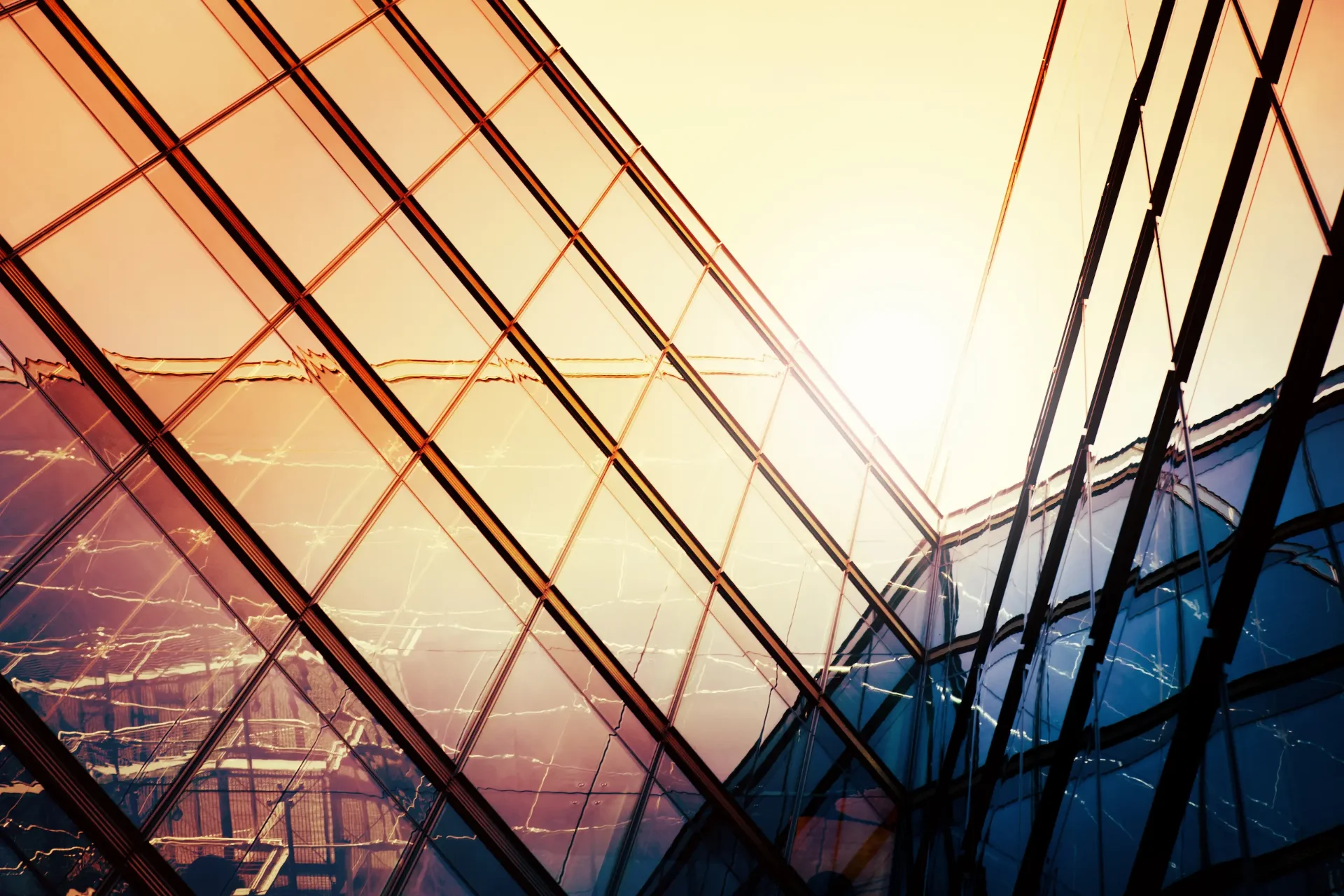 Modern glass architecture at sunset